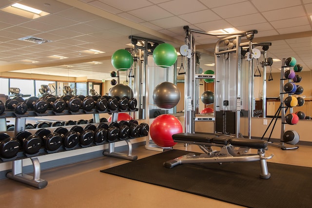 workout area featuring a drop ceiling and visible vents