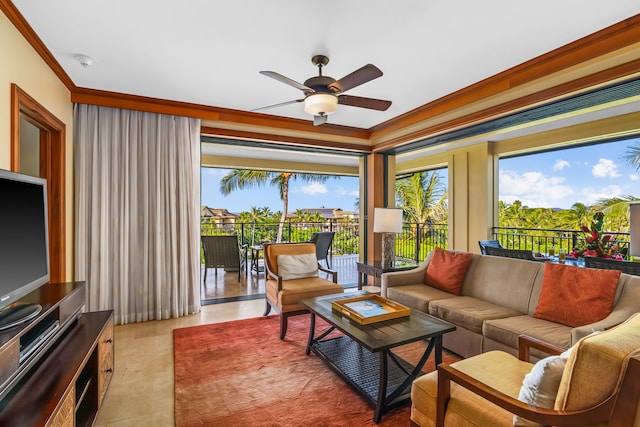 living area with ceiling fan and ornamental molding