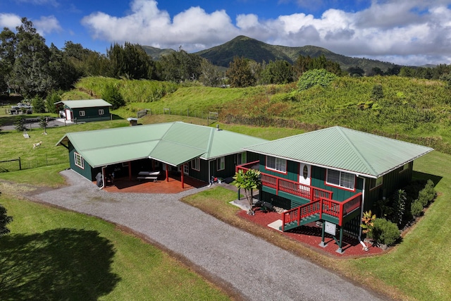 birds eye view of property with a mountain view