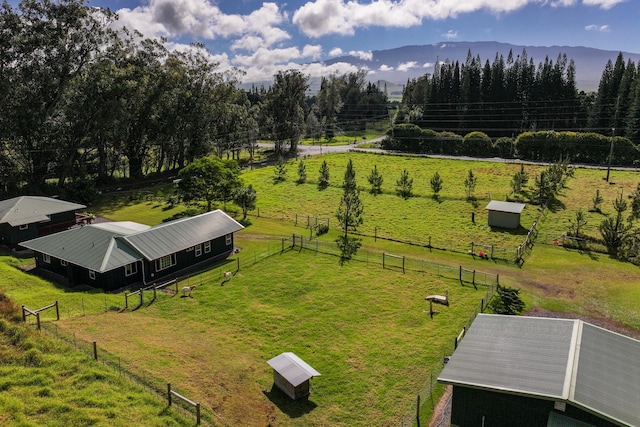 drone / aerial view featuring a mountain view and a rural view