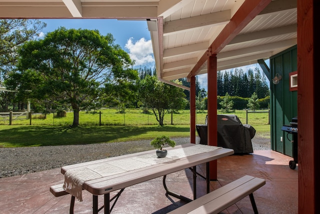 view of patio featuring a grill