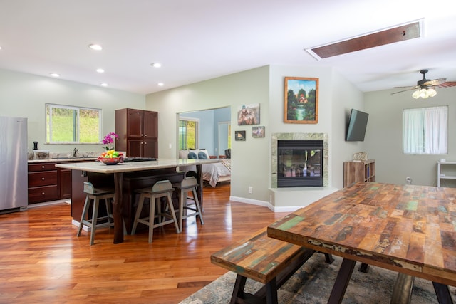 dining space featuring sink and light hardwood / wood-style floors