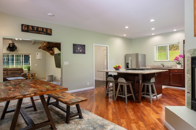 dining room featuring sink and hardwood / wood-style floors