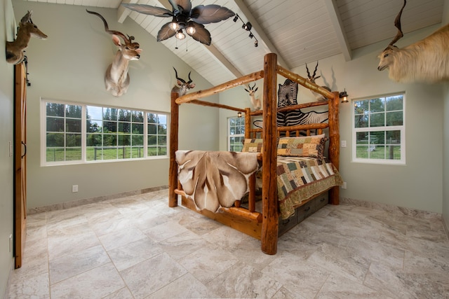 bedroom with beamed ceiling, rail lighting, wooden ceiling, and high vaulted ceiling