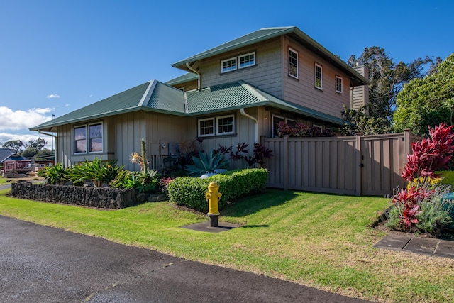 view of home's exterior featuring a yard