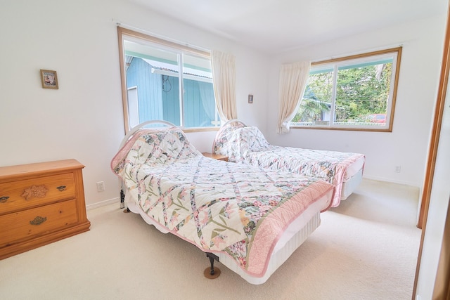 bedroom with light carpet