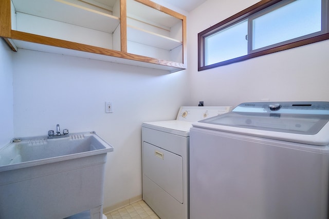 washroom featuring sink and washer and dryer