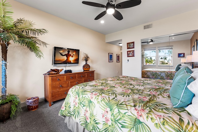 bedroom featuring ceiling fan, a closet, and carpet floors