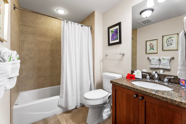 full bathroom featuring tile patterned floors, vanity, toilet, and shower / bath combination with curtain