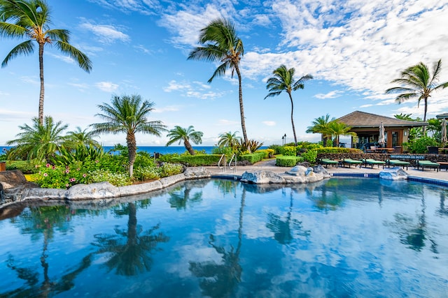 view of pool featuring a water view