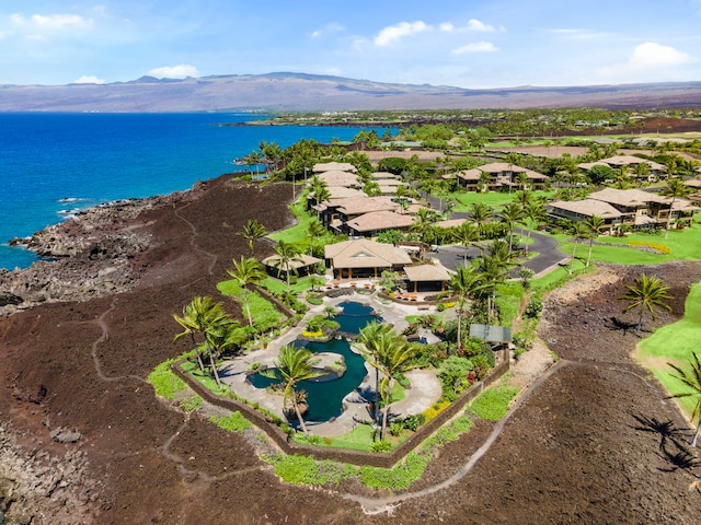 birds eye view of property featuring a water and mountain view