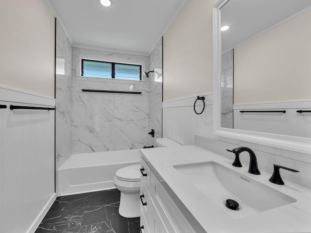 full bathroom featuring toilet, vanity, ornamental molding, and tiled shower / bath