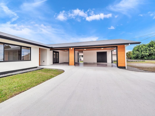 view of front of property with a carport