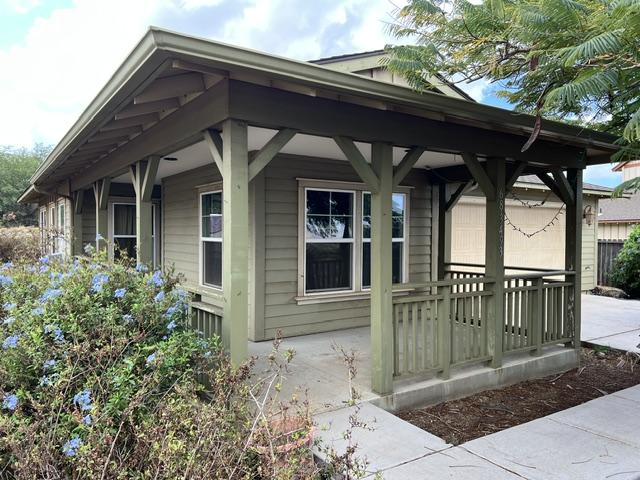 view of property exterior featuring a porch