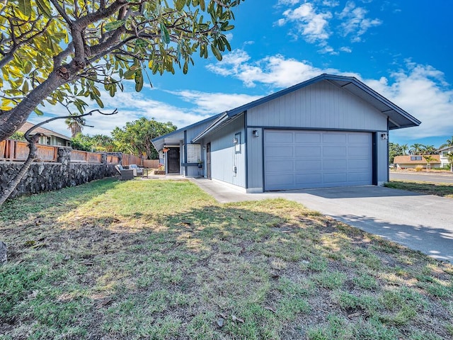 view of front of house featuring a garage and a front yard