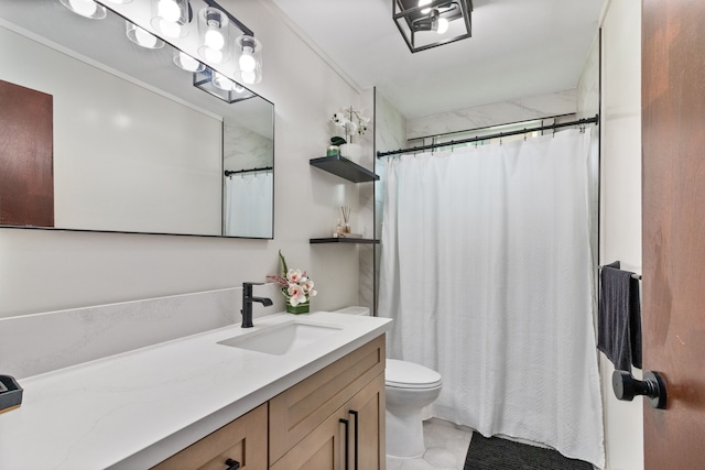 bathroom featuring toilet, vanity, and tile patterned floors