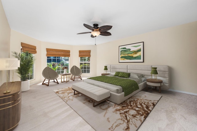 bedroom with ceiling fan and light carpet