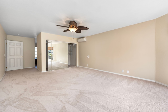 unfurnished bedroom featuring ceiling fan, a closet, light carpet, and a wall unit AC