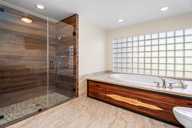 bathroom with toilet and independent shower and bath