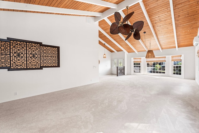 unfurnished living room with beamed ceiling, carpet flooring, wooden ceiling, and ceiling fan