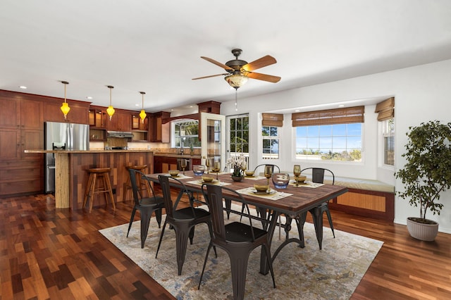 dining space featuring dark hardwood / wood-style floors and ceiling fan