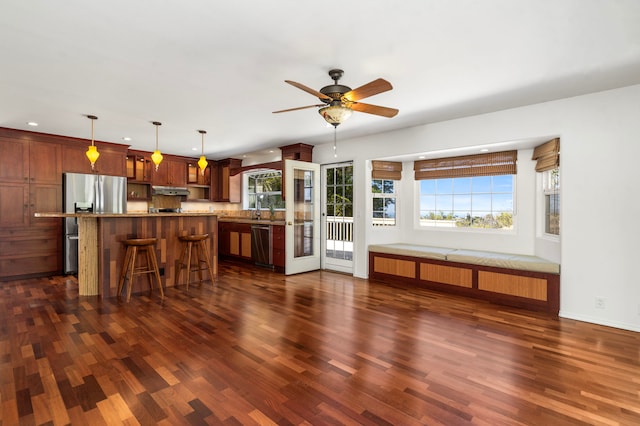 unfurnished living room with dark wood-type flooring, sink, and ceiling fan