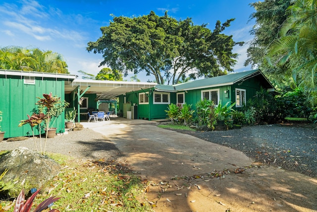 exterior space featuring a carport