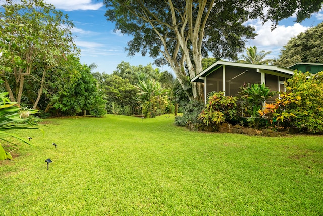 view of yard with a sunroom