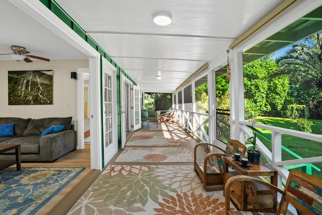 sunroom featuring ceiling fan