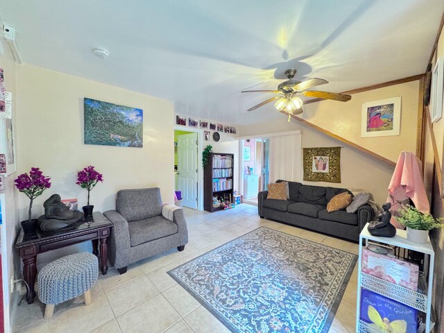 living room featuring ceiling fan and light tile patterned floors