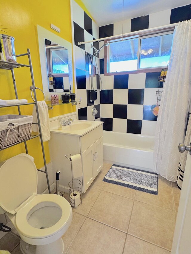 full bathroom with tile patterned flooring, vanity, shower / bath combo, and toilet