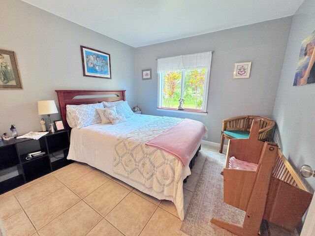 bedroom featuring light tile patterned floors