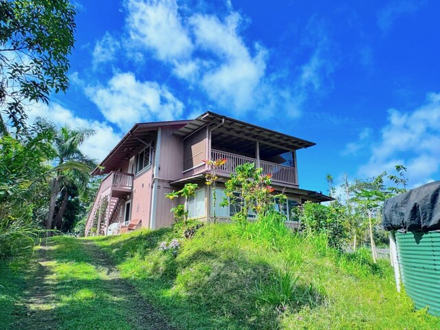 view of property exterior featuring a balcony