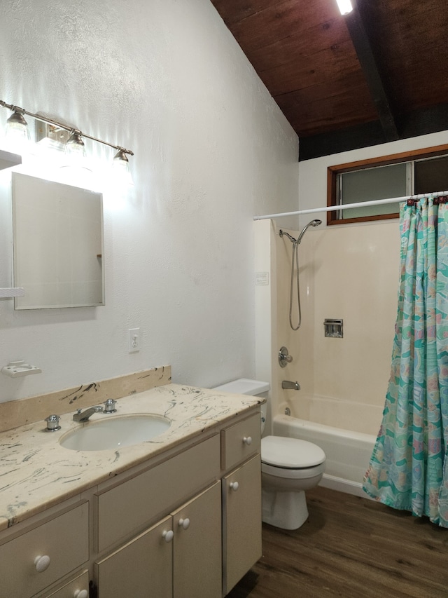 bathroom with toilet, vanity, wood finished floors, and shower / bath combo with shower curtain