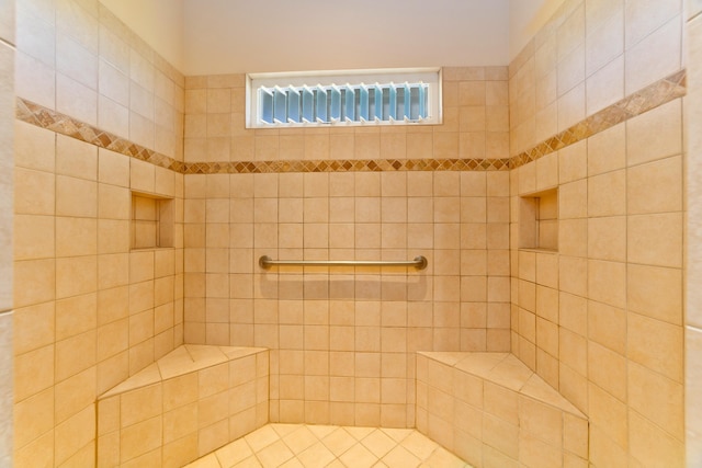 bathroom featuring a tile shower