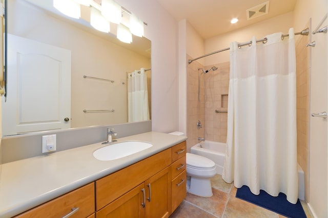 full bathroom featuring vanity, tile patterned flooring, toilet, and shower / bath combo