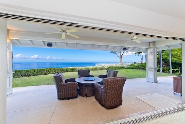 view of patio / terrace with a water view and ceiling fan