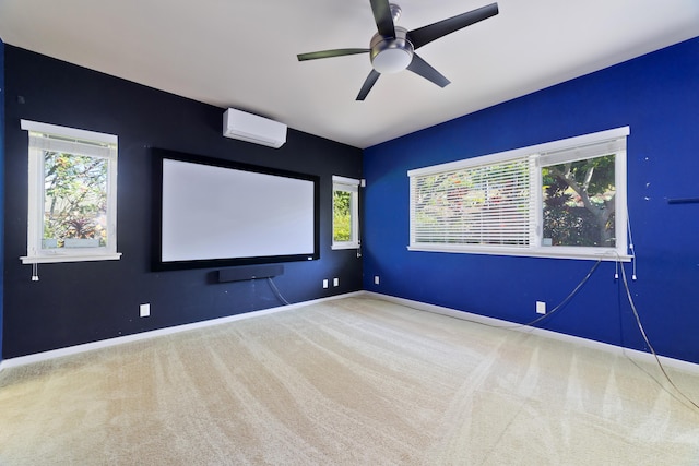 home theater room featuring ceiling fan, a wall mounted AC, and carpet