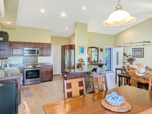 kitchen featuring pendant lighting, high vaulted ceiling, sink, light tile patterned floors, and stainless steel appliances