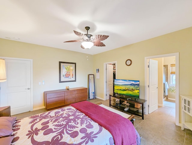 bedroom featuring a spacious closet and ceiling fan