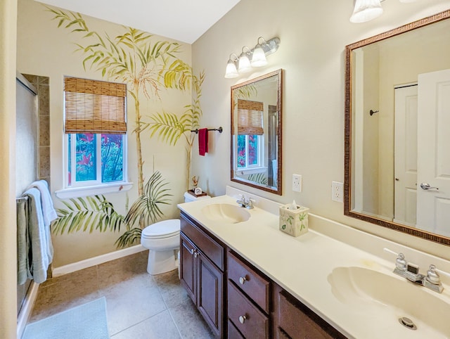 bathroom featuring tile patterned flooring, vanity, and toilet