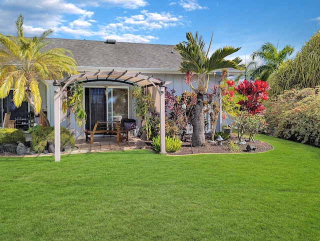 back of property featuring a yard, a patio area, and a pergola