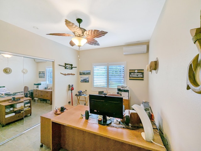 office featuring an AC wall unit and ceiling fan