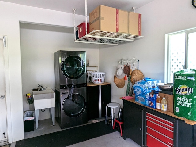 laundry area featuring stacked washer / drying machine