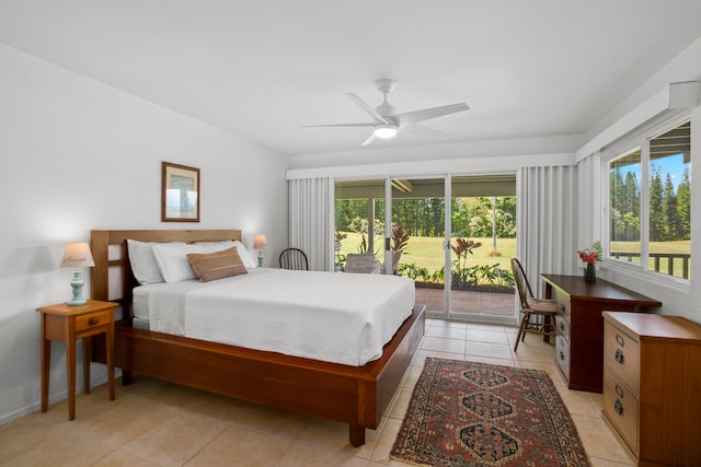 bedroom with access to exterior, light tile patterned floors, and a ceiling fan