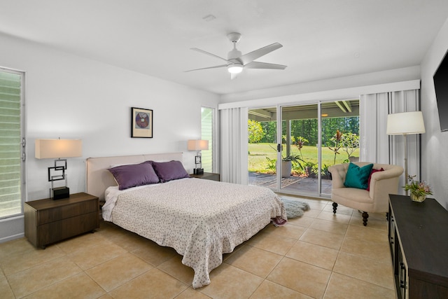 bedroom with access to exterior, a ceiling fan, and light tile patterned floors