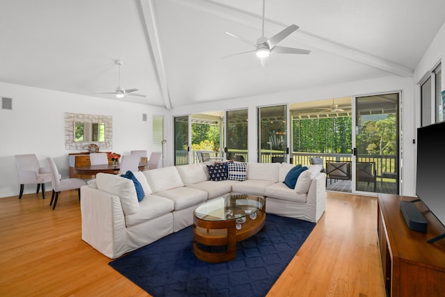 living room with visible vents, a ceiling fan, beam ceiling, and wood finished floors