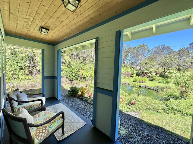 sunroom with wood ceiling