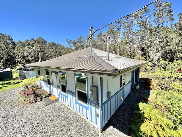 view of property exterior featuring a porch