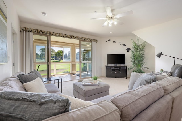 carpeted living room featuring ceiling fan